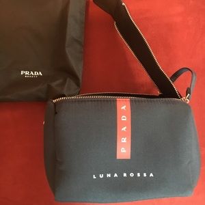 Prada Luna Rossa toiletry bag. Double metal zippers and a snap closure. New.